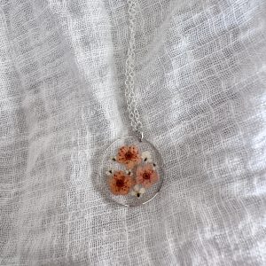 Silver Round Necklace With Orange And White Flowers