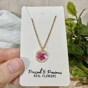 Small Gold Round Necklace With A Pink Flower