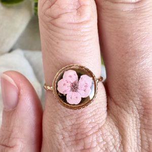 Gold Ring With Twist Detailing And Pale Pink Flower