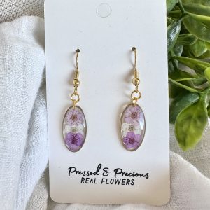 Gold Oval Earrings With A Trio Of Purple And White Flowers