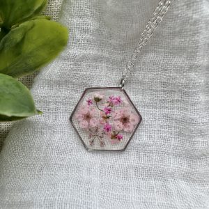 Large Silver Hexagon Necklace With Various Pink Flowers
