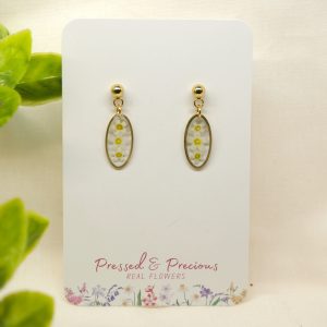 Gold Oval Earrings With White Flowers